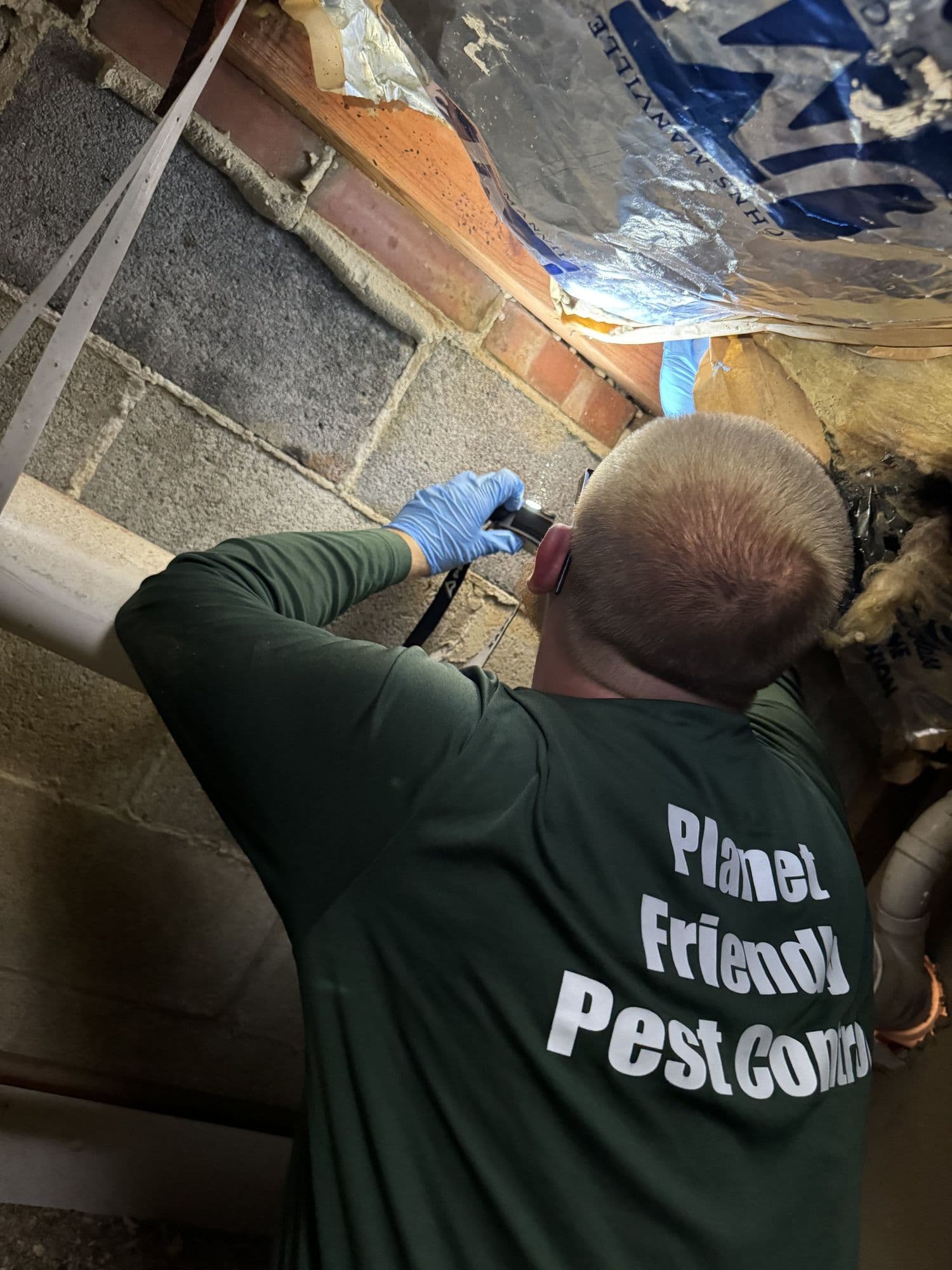 A Planet Friendly Pest Control technician performing an exterior treatment near Abell MD