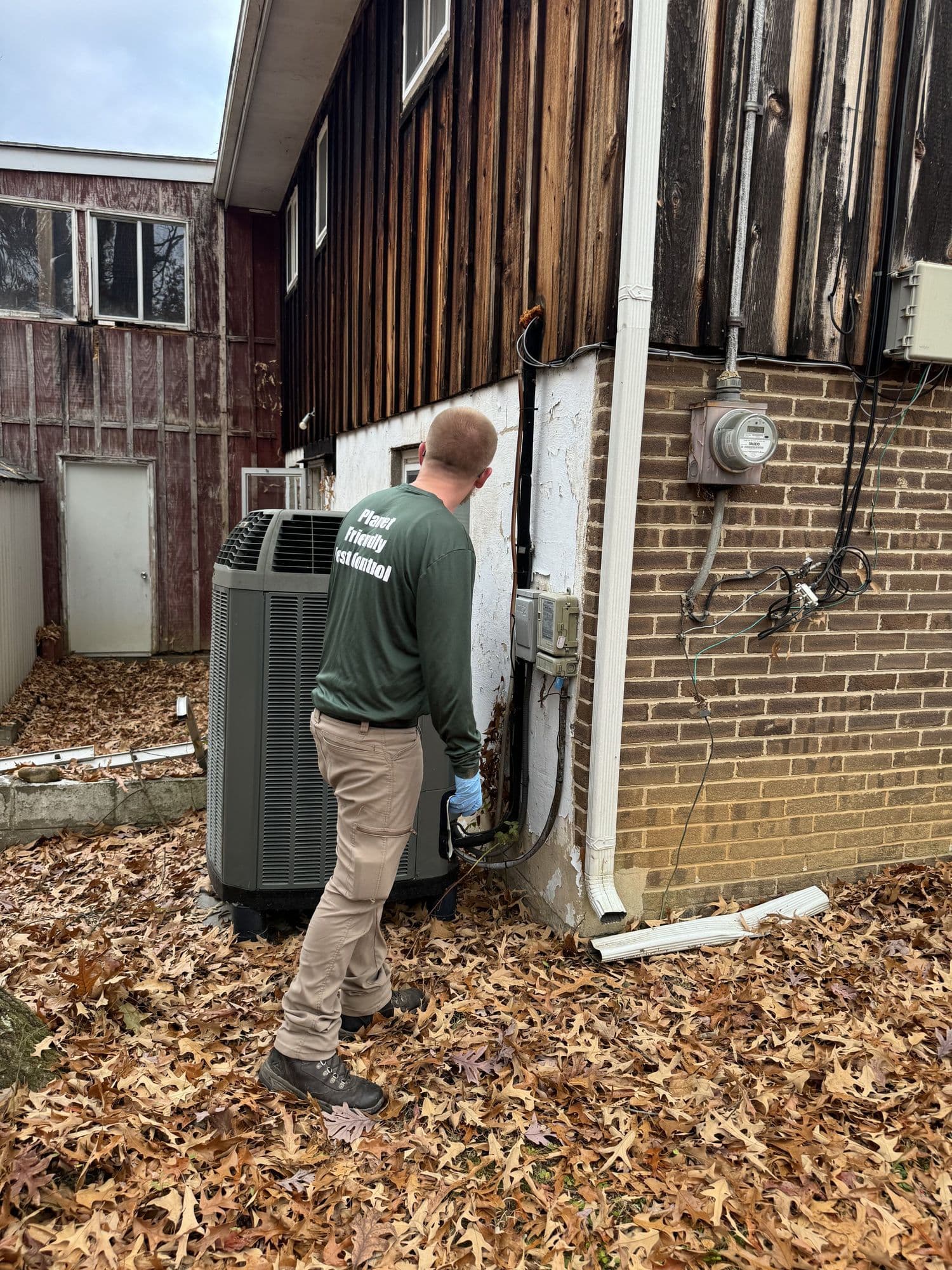 A Planet Friendly Pest Control technician performing an exterior treatment near Dowell MD