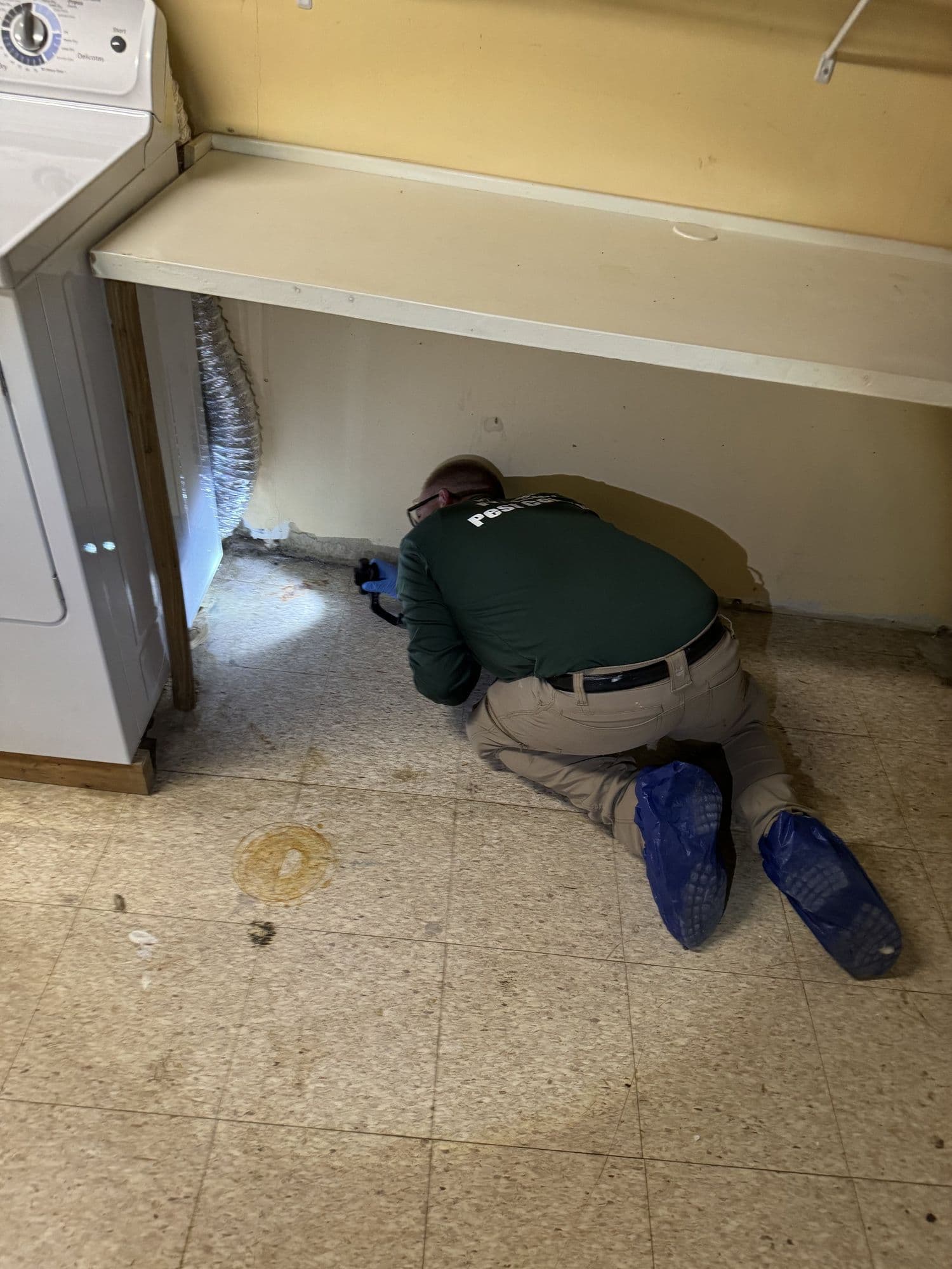 A Planet Friendly Pest Control technician performing an exterior treatment near Chaptico MD