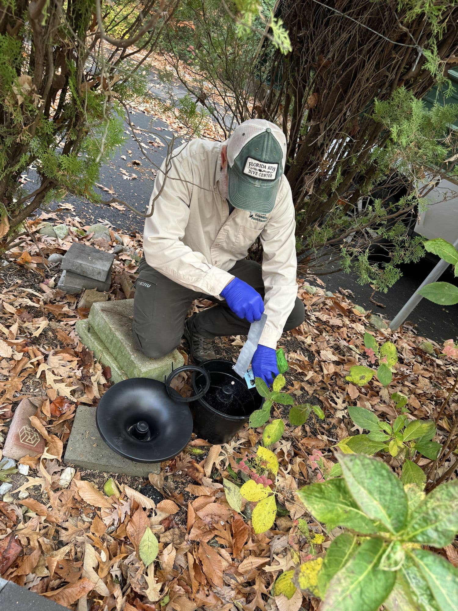 A Planet Friendly Pest Control technician performing an exterior treatment near Upper Marlboro MD