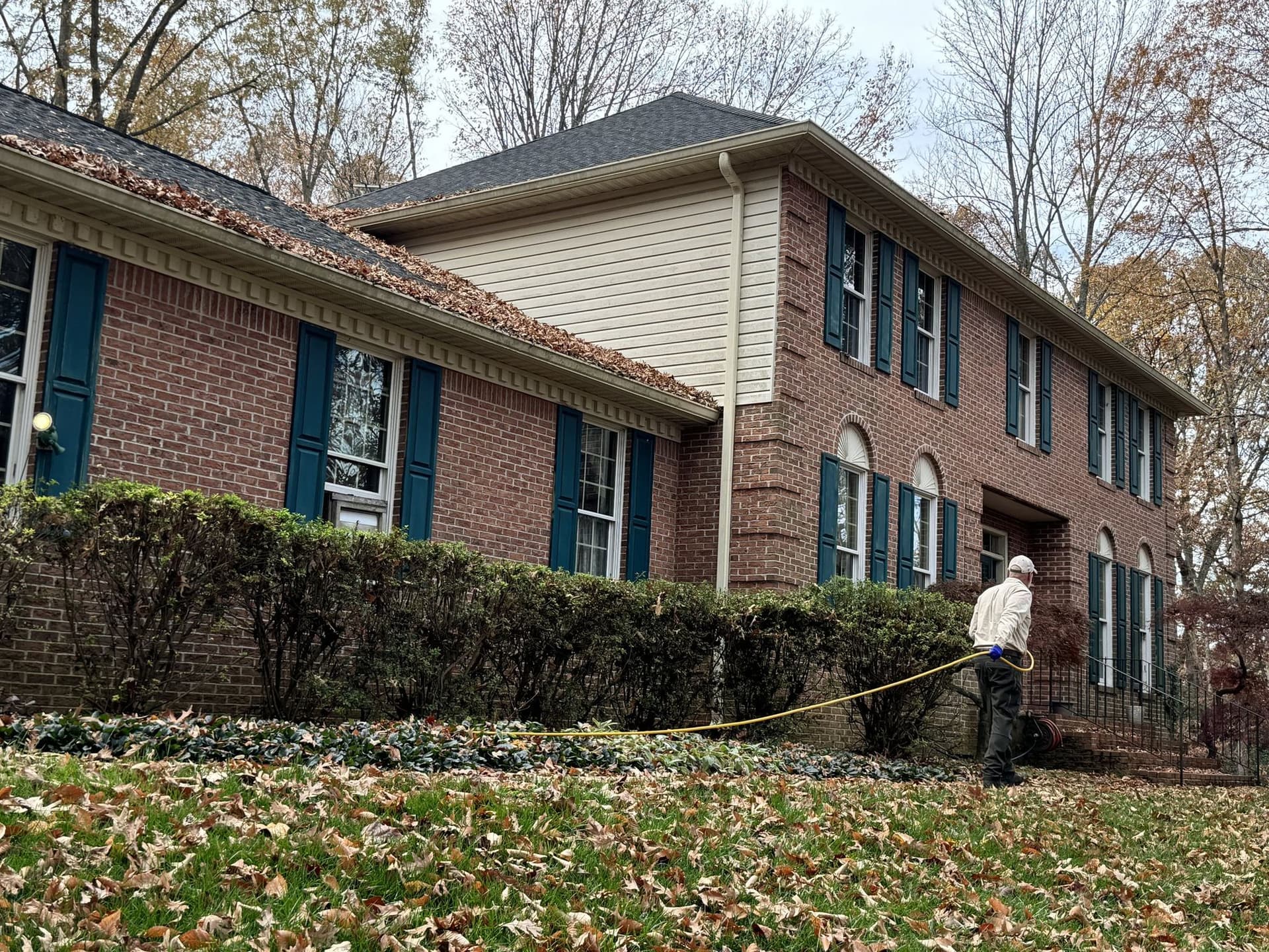 A Planet Friendly Pest Control technician performing an exterior treatment near Saint Inigoes MD