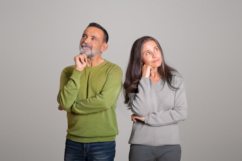 Pensive positive Caucasian aged husband and wife think,